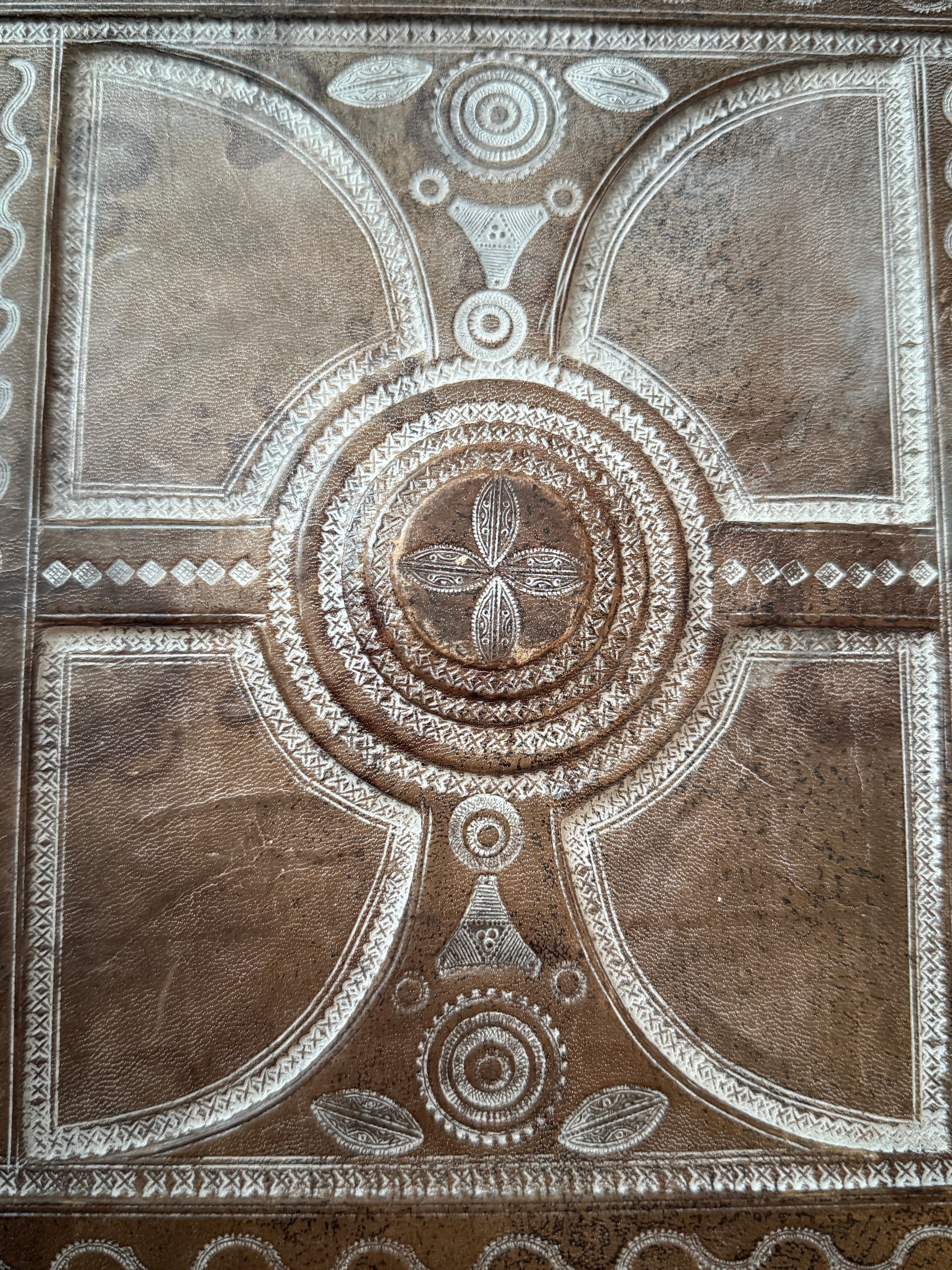 Decorative leather box with intricate patterns and designs